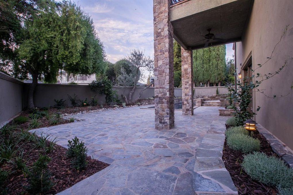 stonework patio with pool